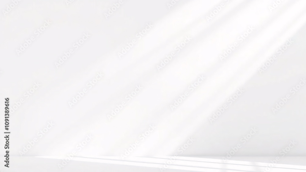 Sunlight beams through window onto white wall. Sunlight beams through window onto white wall.