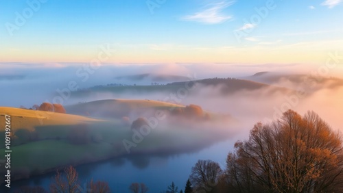 Serene Sunrise Over Misty Valley Landscape: Capture Nature's Beauty for Calm and Relaxation photo