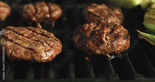 4K: Slide Across Hamburgers Being Flame Grilled