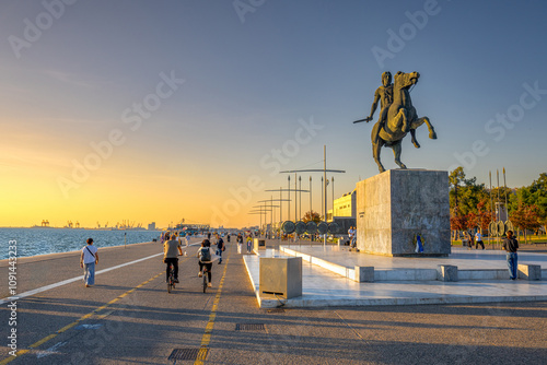 Alexander the Great Statue on the Waterfront Promenade During a Vibrant Sunset with People Enjoying the Seaside Atmosphere in Thessaloniki, Greece