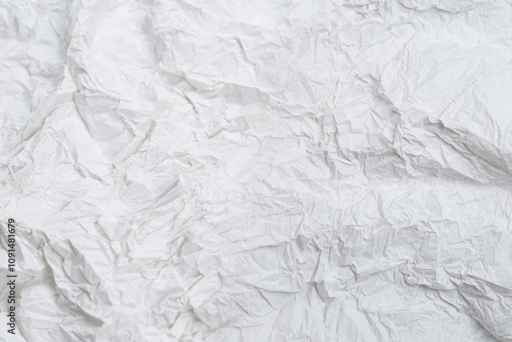 Obraz premium Crumpled white paper background.