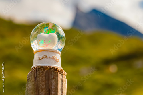 Crystal ball, with a heart inside, alpine summer landscape shot at the famous Hintertux glacier, Tux, Schwaz, Zell am Ziller, Tyrol, Austria photo