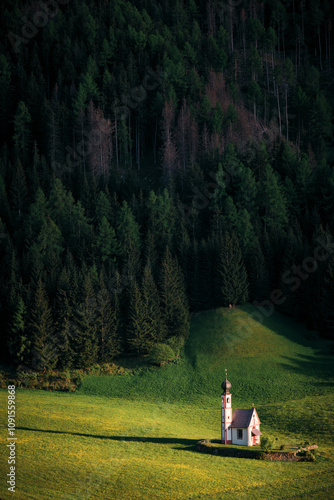 Church in the middle of a meadow in the Dolomites