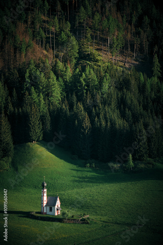 Church in the middle of a meadow in the Dolomites