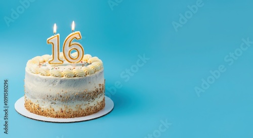 Birthday or anniversary cake with number 16 candle on blue background, perfect for sixteenth birthday or anniversary celebrations and special events photo