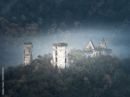 Принти на полотні landscapes view to ruins of medieval castle  and church in foggy morning
