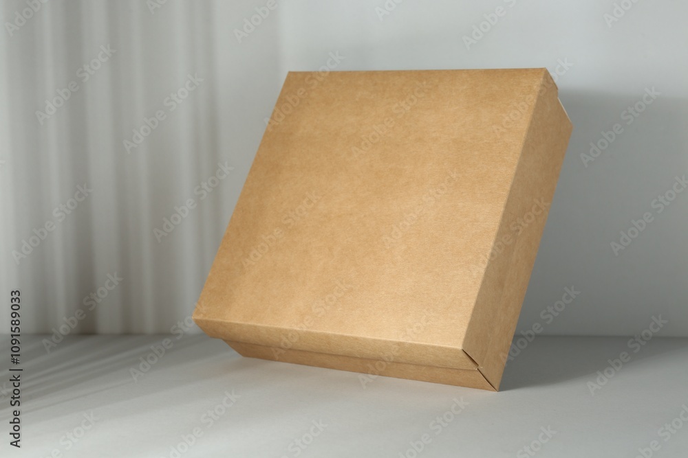 One blank cardboard box on white background. Mockup for design One blank cardboard box on white background. Mockup for design