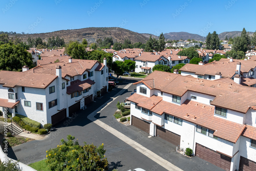 Fototapeta premium Aerial view of residential subdivision condominium house neighborhood in Mission Mesa. South California, USA