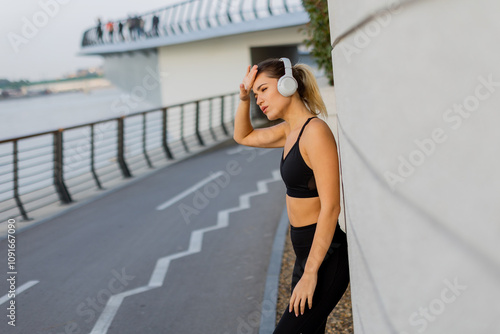 A young woman enjoys music ...