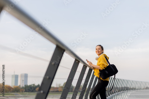 Cheerful woman in a yellow ...