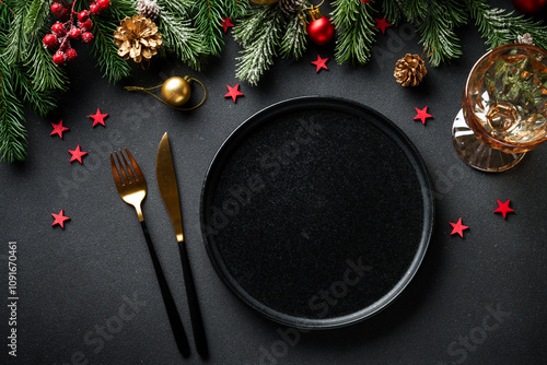 Christmas table. Christmas dinner holiday food with elegant decorations on black. Flat lay with copy space. photo