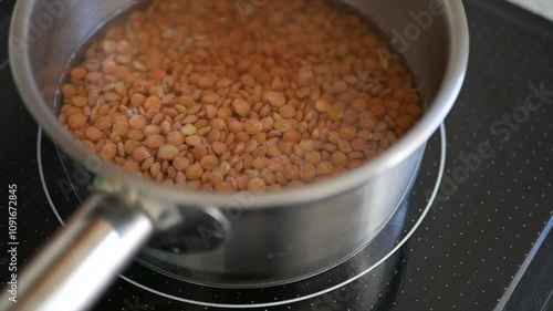 Lentils simmering on low heat. Ideal for vegetarian and vegan diets.