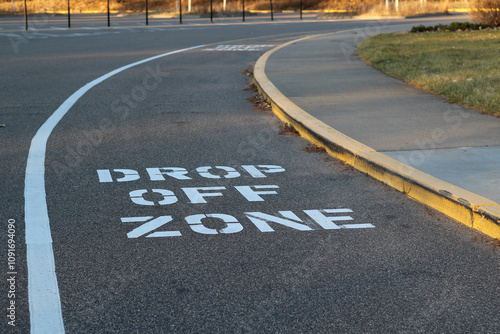 close-up of drop off zone words on asphalt for city planning transporation funding education community parks and recreation backgrounds
