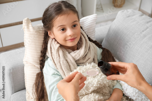Sick little girl with her m...