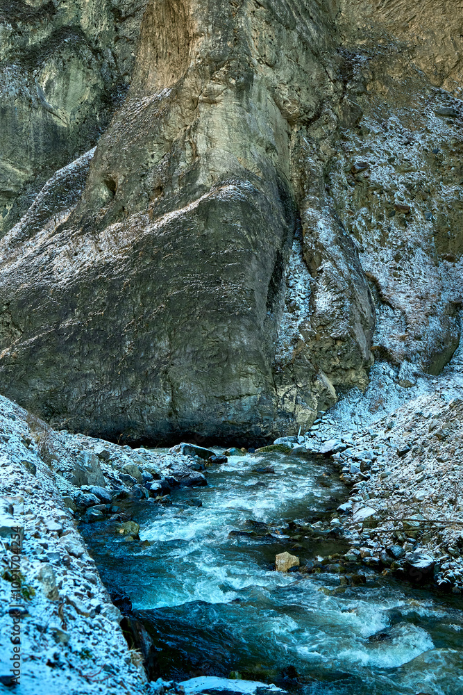 Fototapeta premium gorge with a river in winter in the mountains