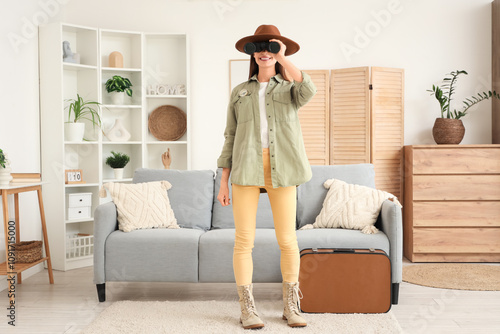 Young woman in a safari hat...