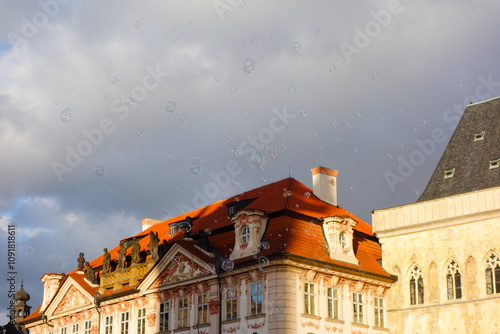 Roof of an old building in prague and the sky with bubbles