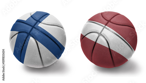 basketball balls with the national flags of latvia and finland on the white background. photo