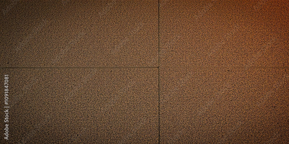 Fototapeta premium Small grit texture cement floor illuminated by warm light, creating a cozy and inviting atmosphere, rough texture, inviting
