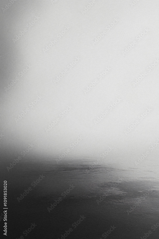 Fototapeta premium Abstract blurry grainy black and white gradient background. Dark grain and noise vertical template for textures, backdrops and wallpapers and overlays with copyspace