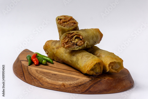 Lumpia or lunpia, traditional snacks from Semarang, Central Java, Indonesia. Traditional spring rolls contain stir-fried bamboo shoots photo