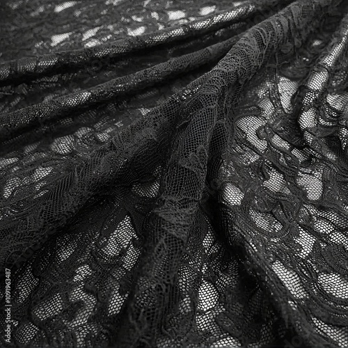 A close-up of delicate black lace fabric showcasing intricate patterns.
