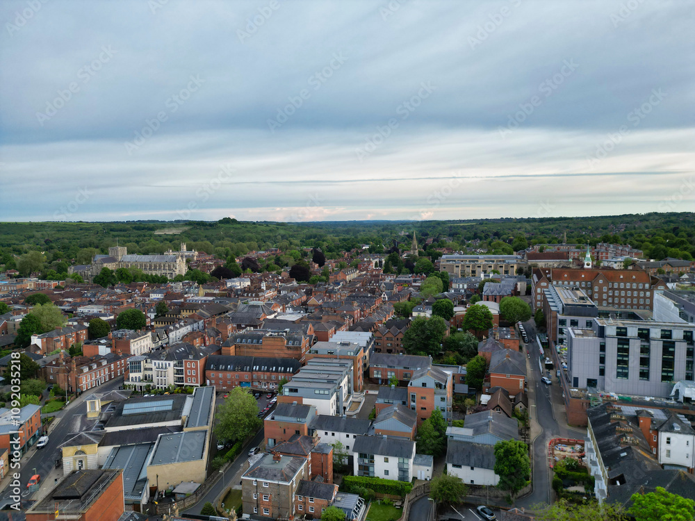 Fototapeta premium High Angle View of British Historical City of Winchester Central During Sunset, England United Kingdom, Aerial Footage Was Captured with Drone's Camera From Medium High Altitude on May 17th, 2024