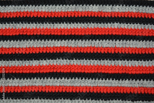 Striped crochet pattern made from red, black and white yarn