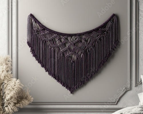 Light grey bedroom with purple macrame wall decor, modern chic.