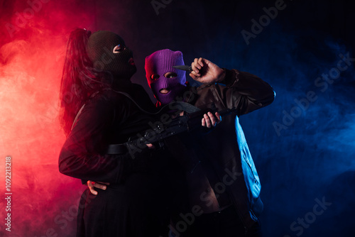 Obraz na płótnie Man And Woman Bandits With Masked Guns