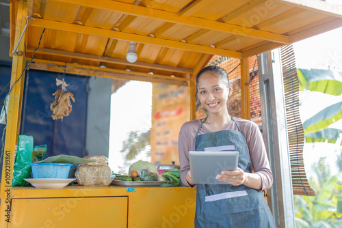 Photography A woman stands at her vibrant food stall, ready to serve fresh ingredients to ea