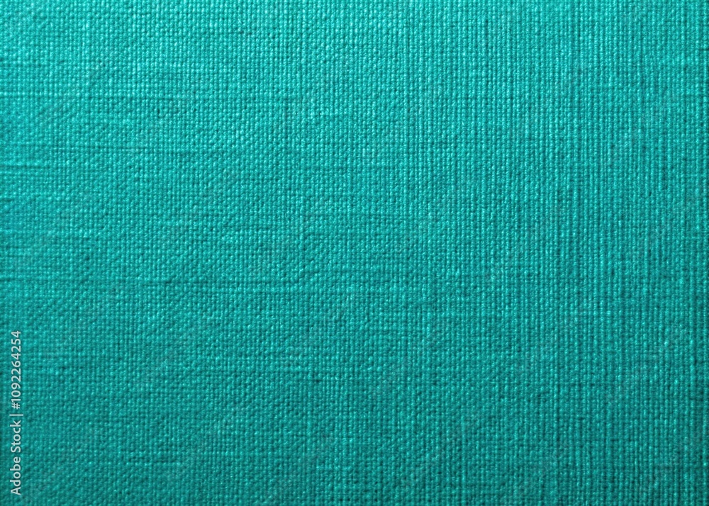 Fototapeta premium Elevate your crafting and design projects with this blue-green linen textured cardstock background, ideal for artistic creations. Its unique texture enhances any project beautifully.