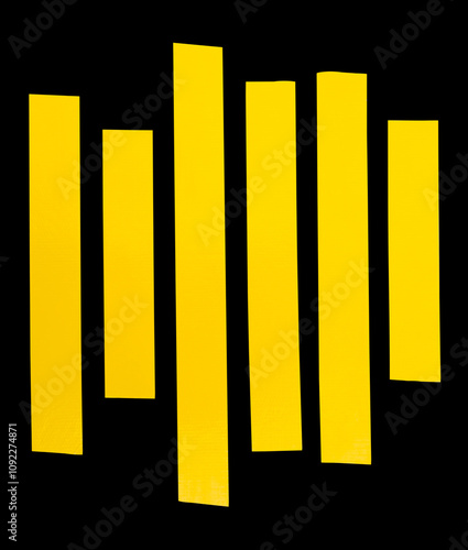 Top view set of yellow adhesive vinyl tape or cloth tape in stripes shape in straight lines isolated on black background with clipping path photo