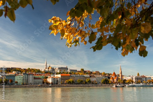 Budapest landscape. Wide angle photo with Budapest castle, Matthias Church and other landmarks of the city with Danube in foreground during an autumn day. Travel to Hungary.