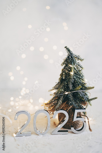 New Year's lights gold and dark red colors bokeh background with glowing number 2025 and fireworks. Happy New Year concept for 2025.