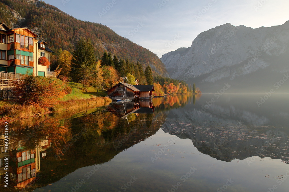 Colorful Autumn scenery and reflections on the lake Altausseer See in Altaussee, Bad Aussee, Salzkammergut, Styria, Austria, Europe, with the Trisselwand mountain in the background