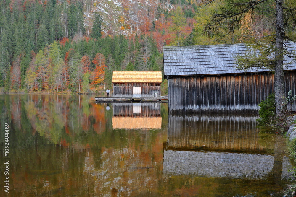 Colorful Autumn scenery and reflections on lake Odensee in Pichl Kainisch, Bad Aussee, Salzkammergut, Styria, Austria, Europe. The Odensee is a natural lake surrounded by a nature reserve