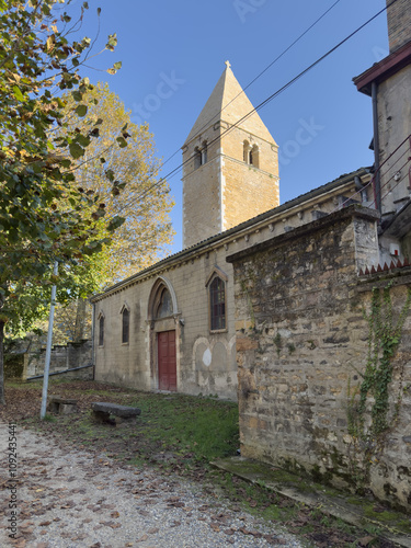 Historic Church with Bell Tower Surrounded by Autumn Trees Île Barbe