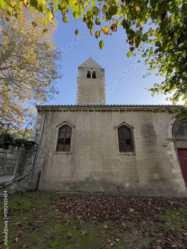 Historic Church Bell Tower Framed by Autumn Leaves Île Barbe