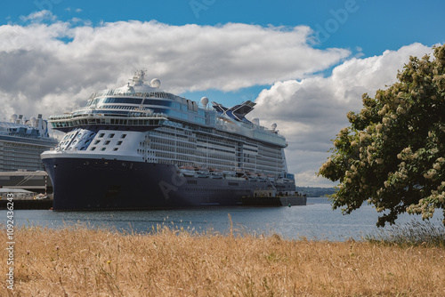 Modern Celebrity family cruiseships cruise ship ocean liners in port of Seattle, Washington State docked at terminal before Alaska summer cruising on sunny day