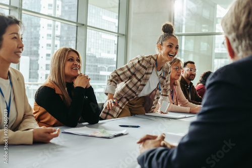 Business professionals engaged in vibrant discussion during a meeting photo