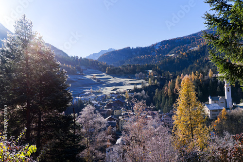 Scenic aerial view of alpine landscape with idyllic Swiss mountain village of Tiefencastel at Albula Valley on a sunny autumn day. Photo taken November 15th, 2024, Tiefencastel, Switzerland. photo