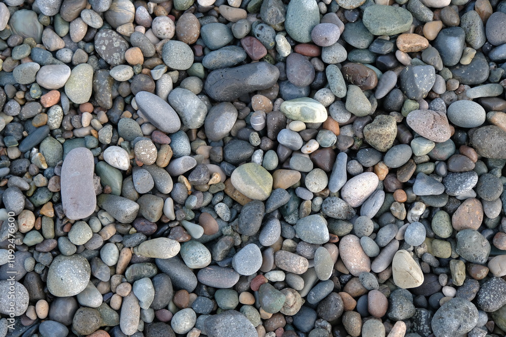 stones background. natural background stones on the beach. multi-colored pebbles with rounded stones as a background stones background. natural background stones on the beach. multi-colored pebbles with rounded stones as a background