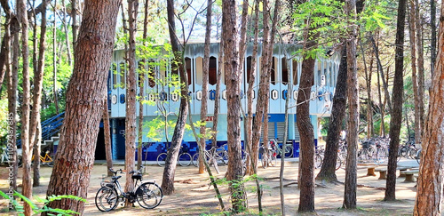 Tableau sur toile Blue round building of a public toilet ( Rotonda 5 ) in a pine forest near the beach in Legnano Sabbiadoro