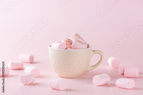 Vegan chocolate drink with marshmallows in a mug on a pink background. Homemade, sugar and lactose free.