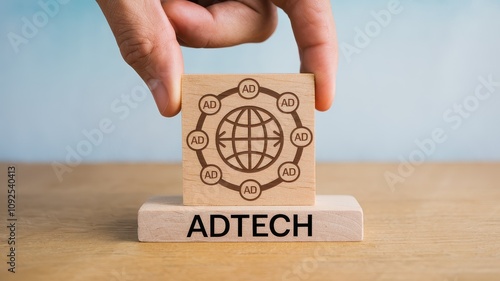 Wooden block with the word  ADTECH  written on it symbolizing the of advanced technology and digital solutions in modern business strategies marketing and industry development photo