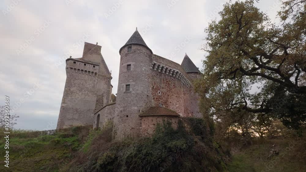 Historic Château du Bouchet in Rosnay France surrounded by nature under a soft cloudy sky Historic Château du Bouchet in Rosnay France surrounded by nature under a soft cloudy sky