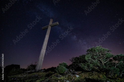 Milky way in a summer night with a christian cross in a Franqueira, in a summer night. Galicia, Spain