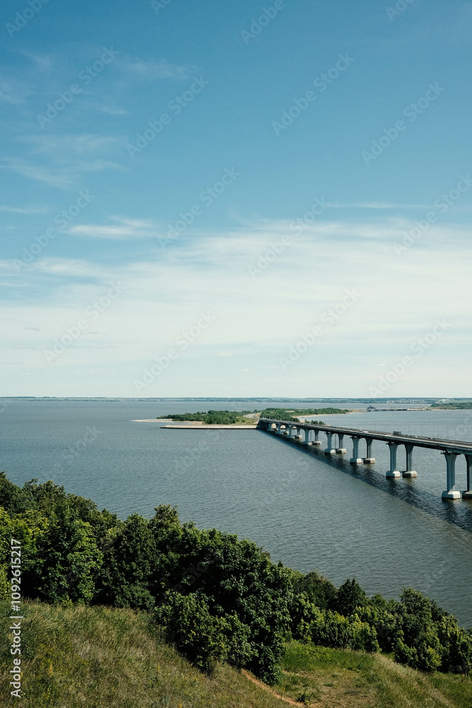 Automobile bridge over the Kama River. View of the Kama from the Sorochi Mountains in Tatarstan. Beautiful summer landscape. Automobile bridge over the Kama River. View of the Kama from the Sorochi Mountains in Tatarstan. Beautiful summer landscape.