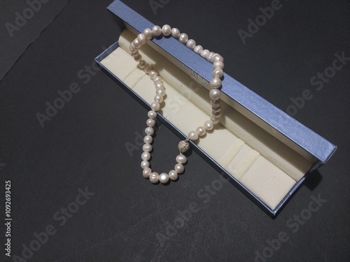 pearl necklace with blue box isolated